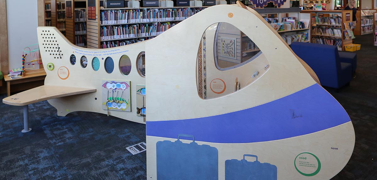 sponsored childrens' library interactive airplane exhibit