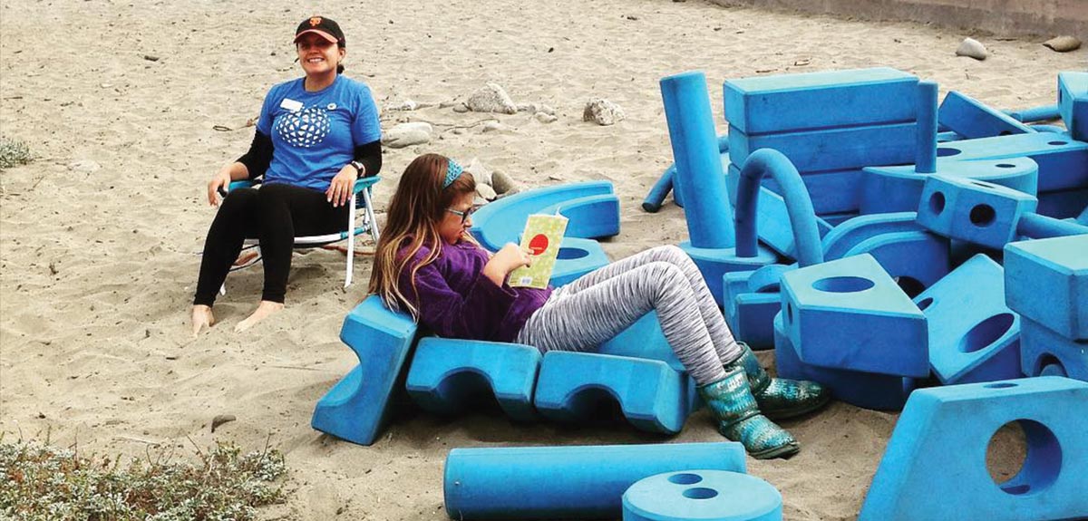 child enjoying San Mateo County Libraries mobile LookMobile